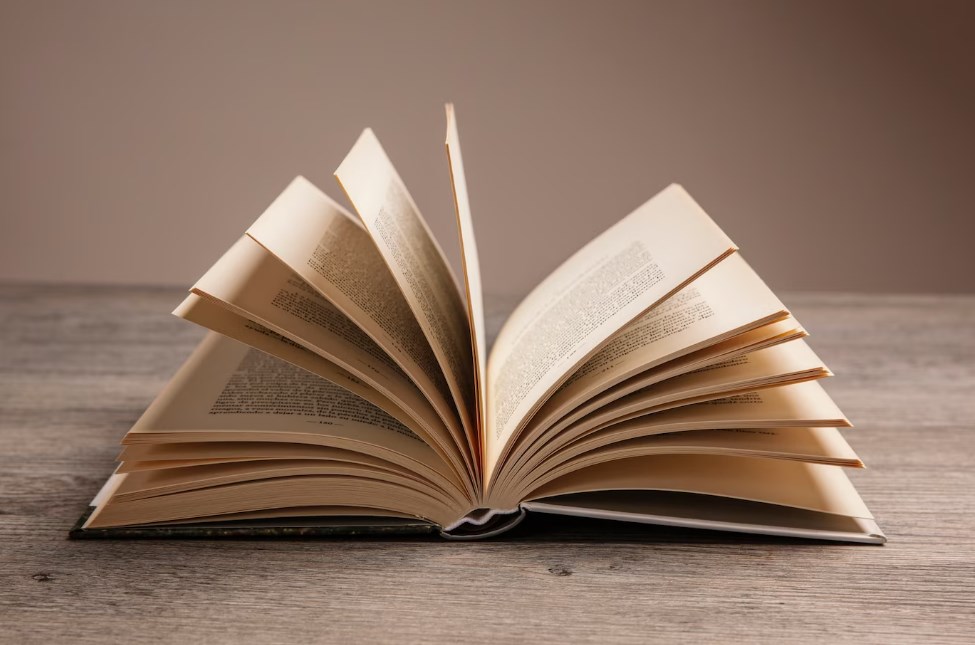 an open book on a wooden table