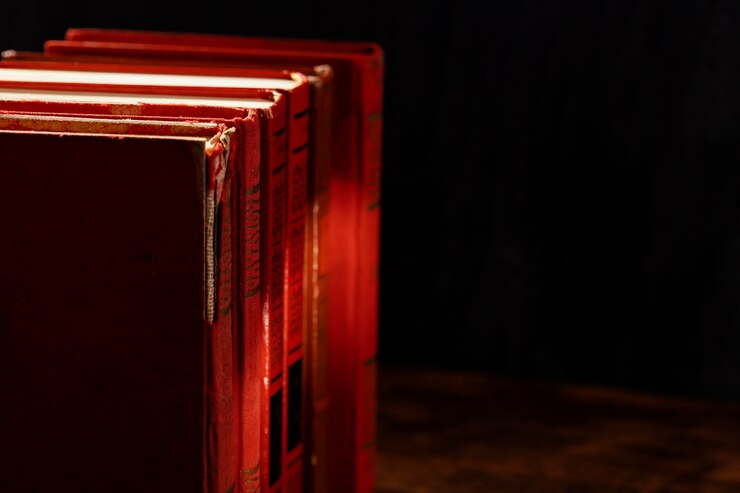 Red Books on Dark Background