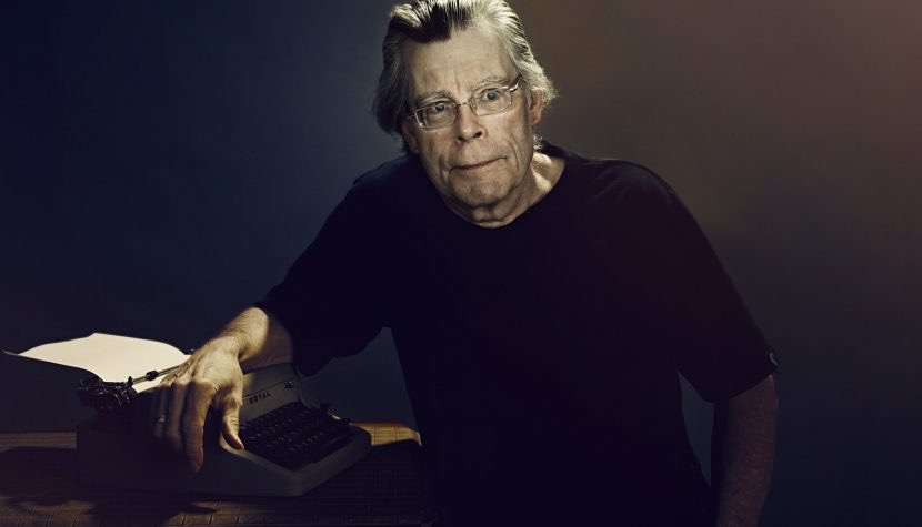Stephen King next to his typewriter