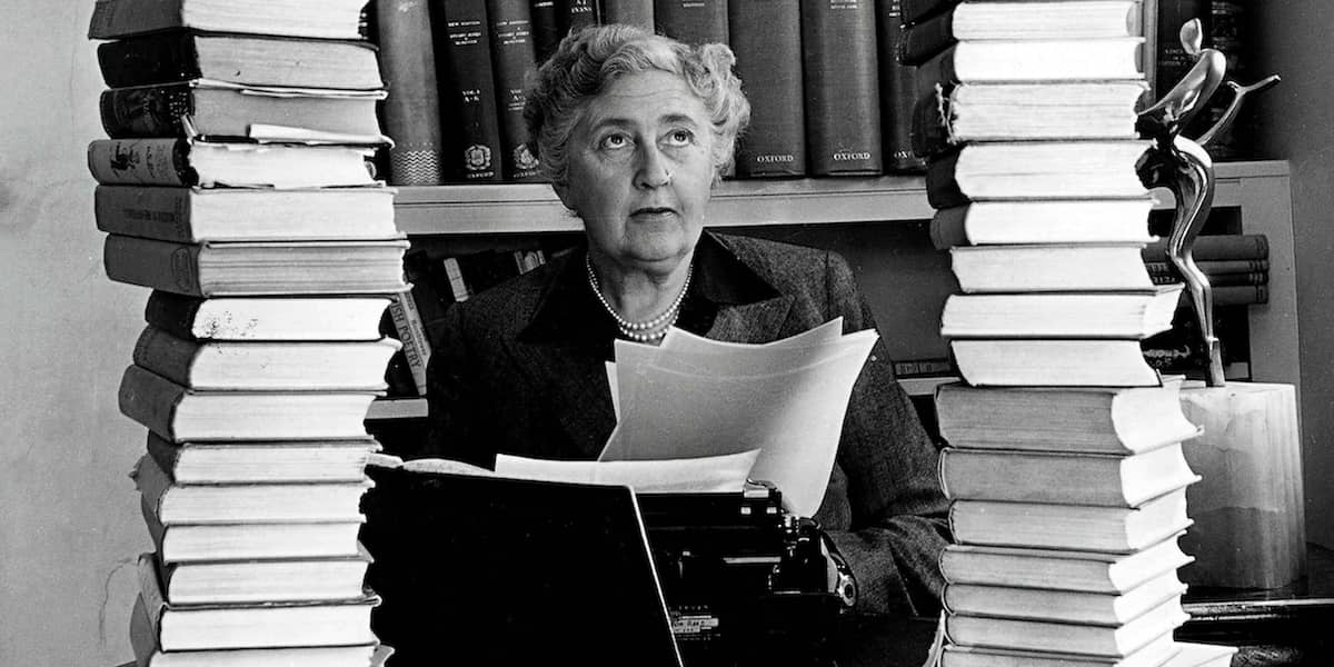 Agatha Christie Sitting Behind Books